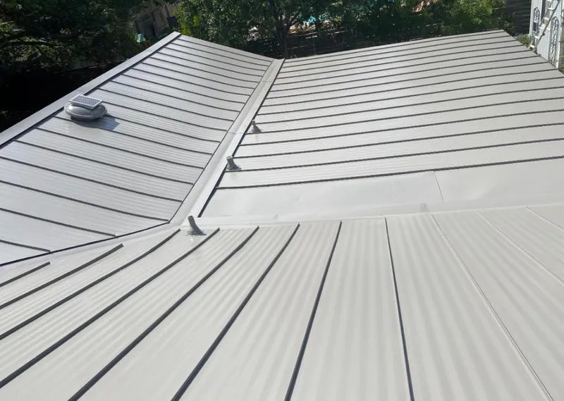 Solar attic fan installed on a metal roof for Roof Ventilation in Santa Clara